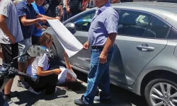 Muğla'da vatandaşlar, yaralı kadın sürücüyü havluyla güneşten korudu